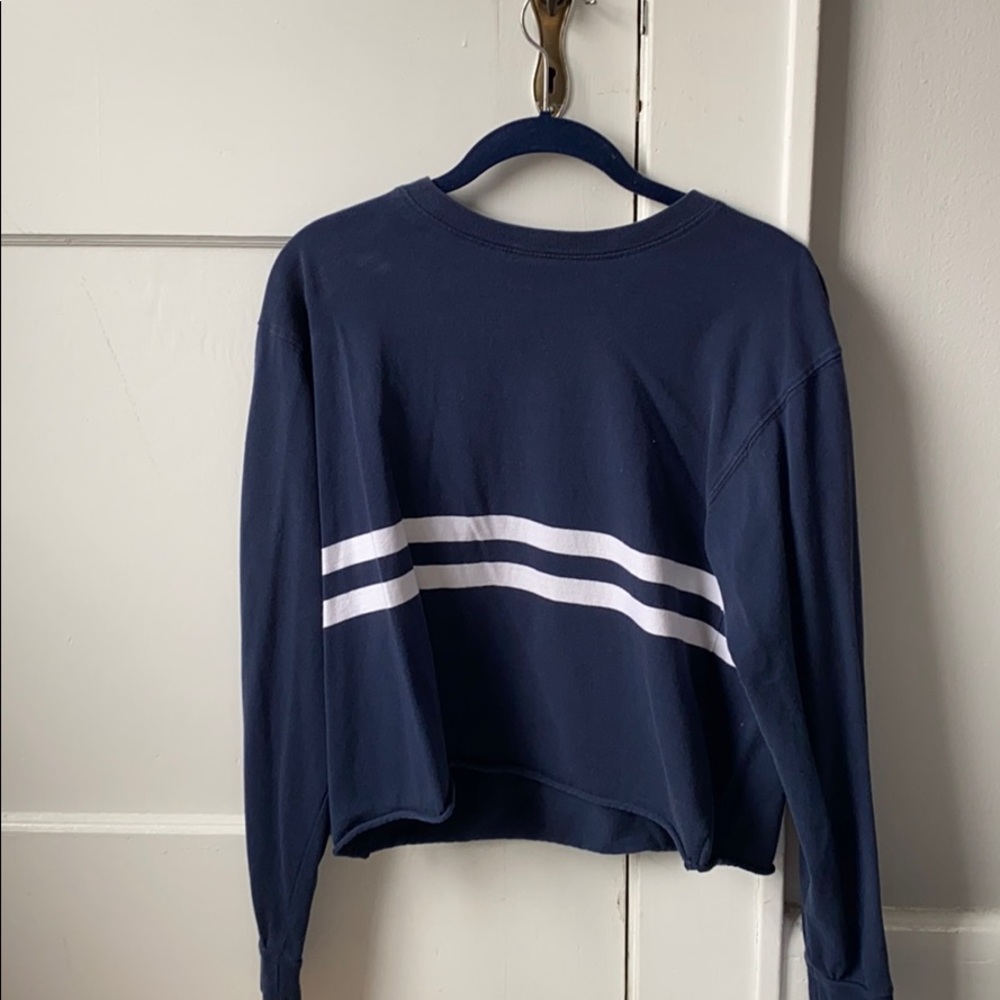navy blue crew neck with simple white stripes.